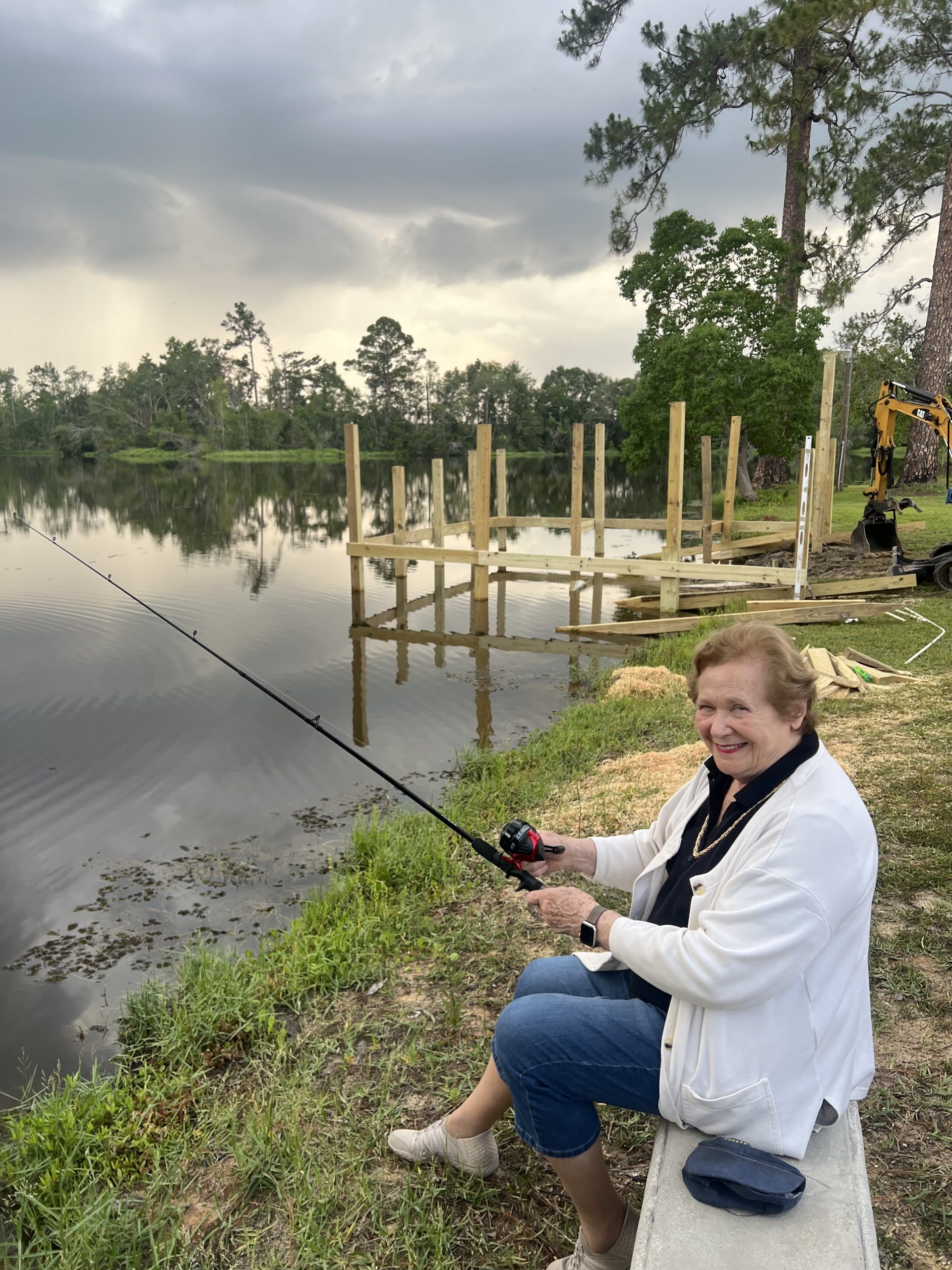 Sara Walker trying to catch a fish while others work on the doc